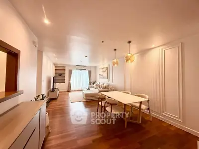 Spacious modern living room with elegant dining area and cozy seating.