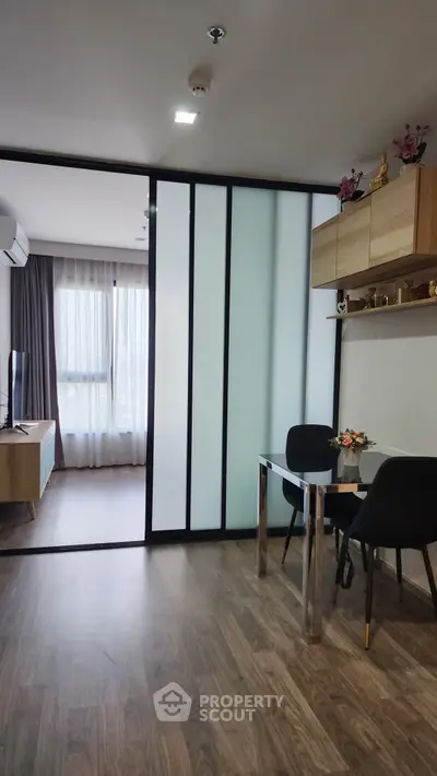 Modern living room with sliding glass doors and stylish furniture