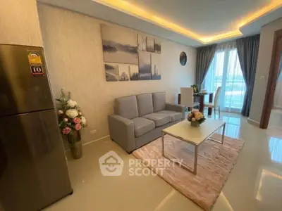 Modern living room with elegant decor and natural light, featuring a cozy sofa and dining area.