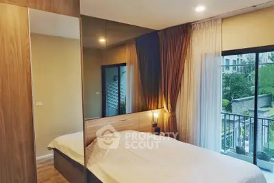 Modern bedroom with large window and balcony view in stylish apartment