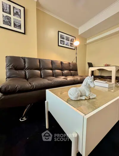 Cozy living room with modern leather sofa and stylish decor