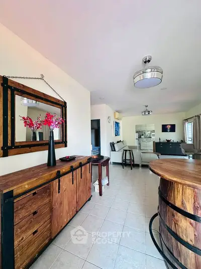 Spacious living room with rustic wooden furniture and modern decor