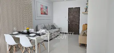 Modern living room with stylish decor and dining area in a cozy apartment