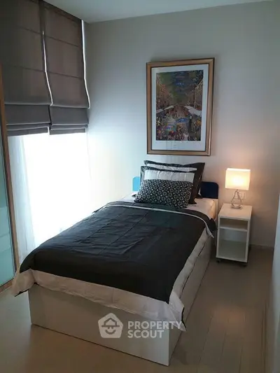 Cozy modern bedroom with stylish decor and natural light