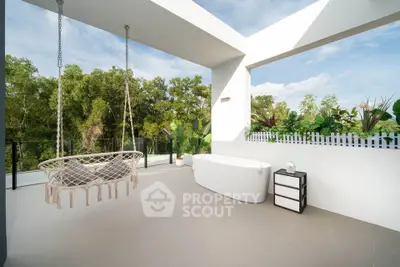 Luxurious balcony with outdoor bathtub and hammock overlooking lush greenery.