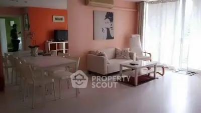 Spacious living room with modern decor and natural light