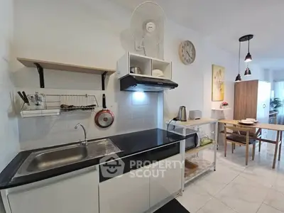 Modern kitchen with sleek black countertop and open shelving