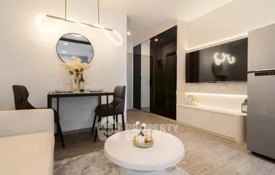 Modern living room with stylish decor and open layout, featuring a cozy dining area and sleek TV setup.