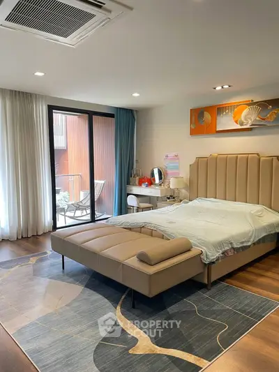 Luxurious bedroom with modern decor and private balcony access