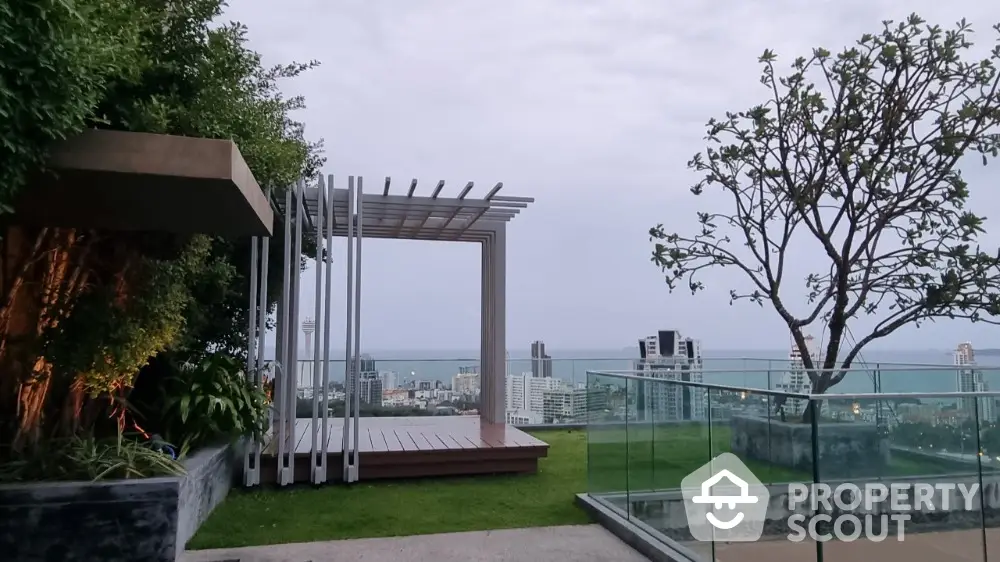 Stunning rooftop garden with panoramic city and ocean views, perfect for relaxation and entertainment.