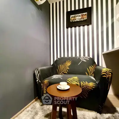Cozy corner with stylish armchair and coffee table in modern living room.