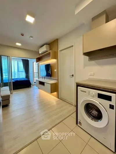 Modern apartment interior with washing machine and stylish living area
