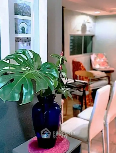 Charming living room with modern decor and vibrant indoor plant