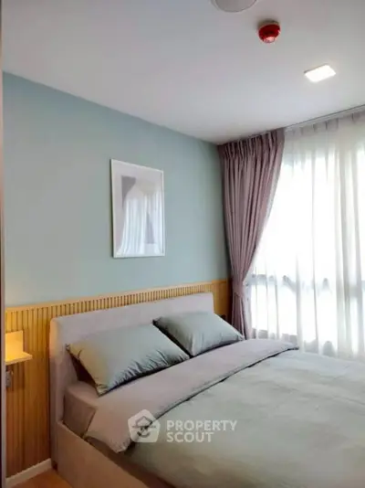 Cozy bedroom with soft lighting and elegant curtains in modern apartment