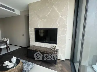 Luxurious living room with marble accent wall and modern decor