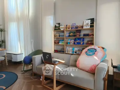 Charming living room with cozy sofa, stylish decor, and natural light