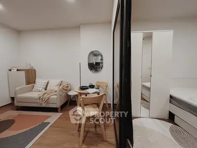 Modern studio apartment with cozy living area and stylish decor