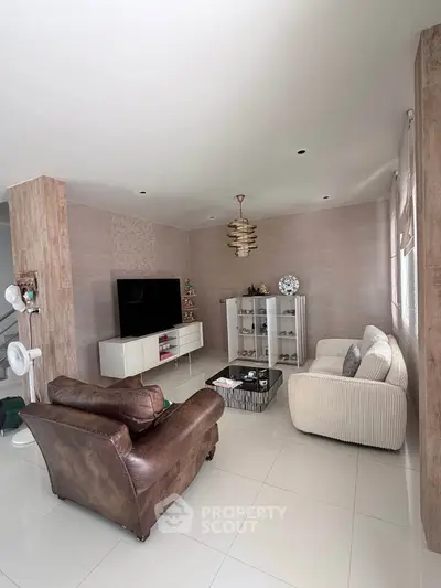 Spacious living room with modern decor and comfortable seating