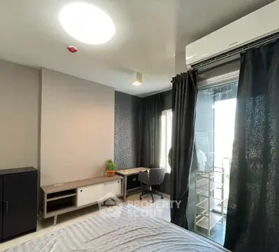 Modern bedroom with air conditioning and balcony access in stylish apartment