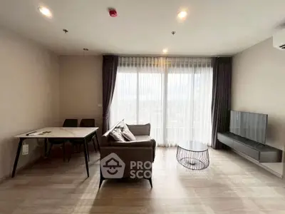 Modern living room with large windows and minimalist furniture