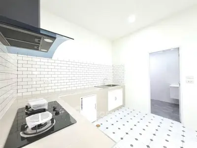 Modern kitchen with sleek gas stove and stylish tile backsplash