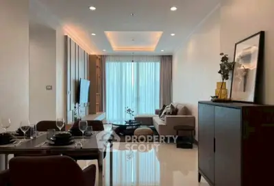 Elegant living room with modern decor and dining area, featuring cozy seating and ambient lighting.