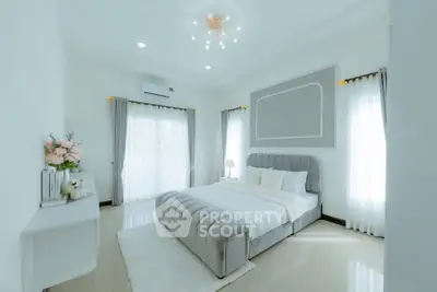 Elegant bedroom with modern decor and natural light