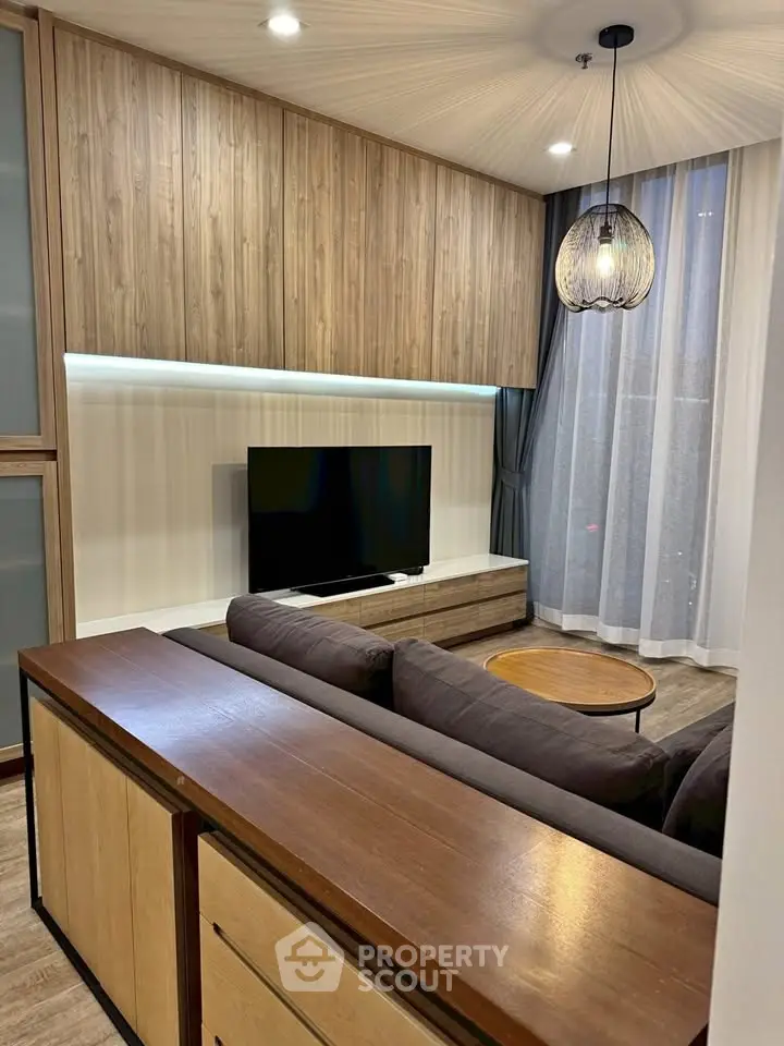 Modern living room with stylish wood paneling and cozy seating area