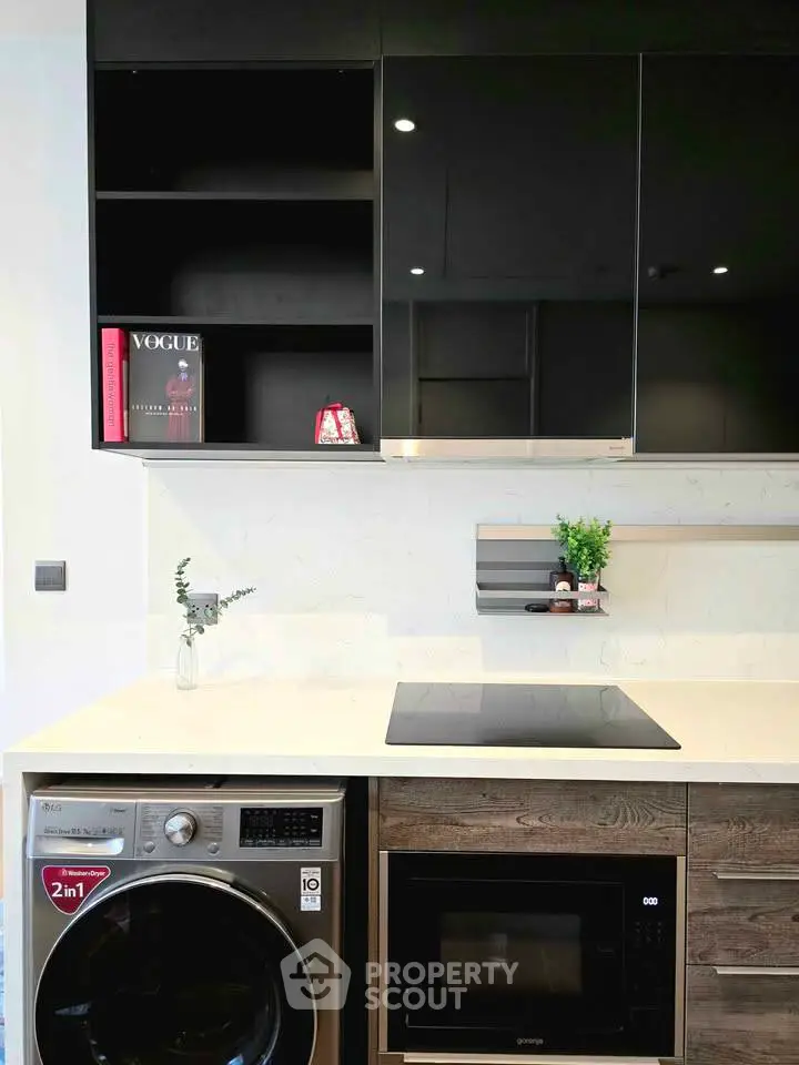 Modern kitchen with sleek appliances and stylish cabinetry