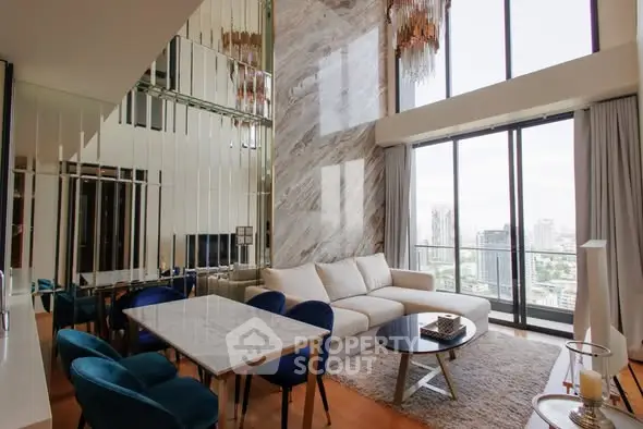Luxurious high-rise living room with stunning city view and elegant decor.