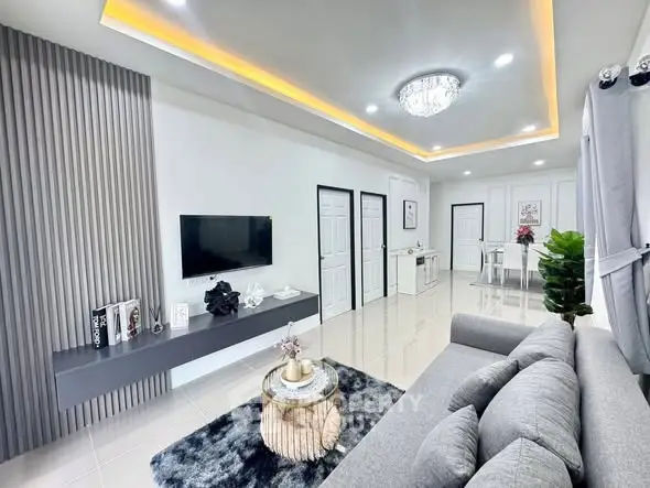 Modern living room with sleek design and elegant lighting