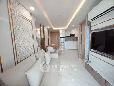 Modern living room with elegant decor and open kitchen layout