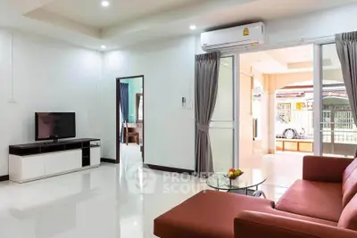 Spacious living room with modern furniture and natural light