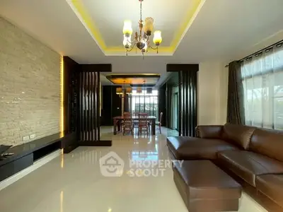 Spacious living room with elegant lighting and modern decor