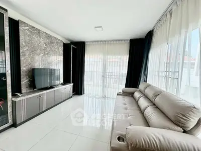 Luxurious modern living room with sleek marble accents and plush leather sofa.