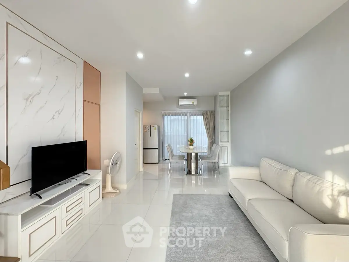 Spacious modern living room with elegant decor and natural light