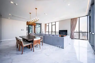Spacious modern living room with city view and elegant dining area