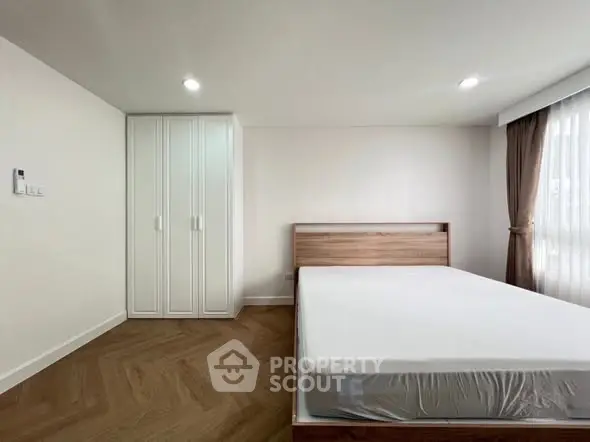 Spacious bedroom with modern design and natural light