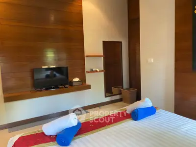 Luxurious bedroom with modern wooden paneling and stylish decor