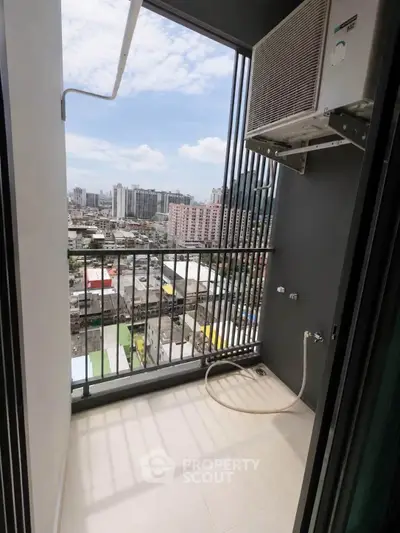 Modern balcony with city view and air conditioning unit, perfect for urban living.