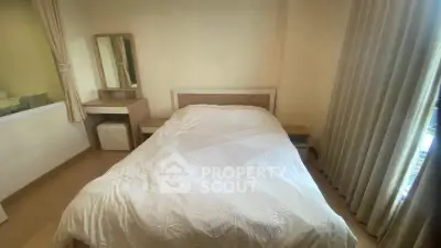 Cozy bedroom with modern furnishings and natural light