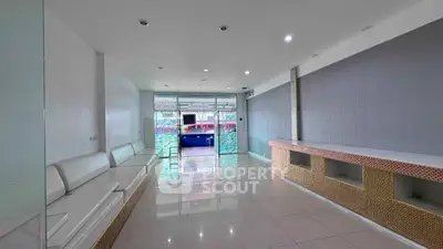 Spacious modern living room with sleek design and ample natural light, perfect for relaxation and entertainment.