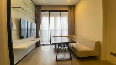 Modern living room with sleek TV setup and cozy seating area