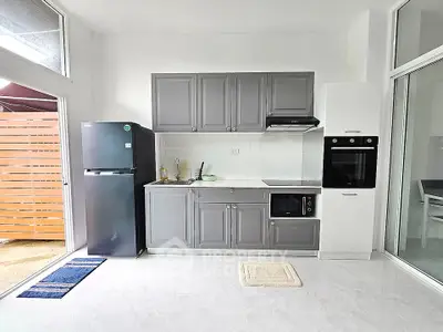 Modern kitchen with sleek gray cabinets and built-in appliances