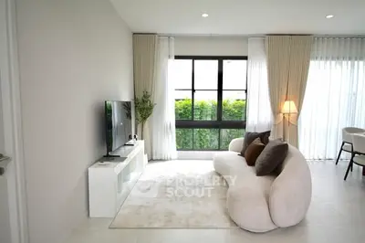 Modern living room with stylish sofa and large window view