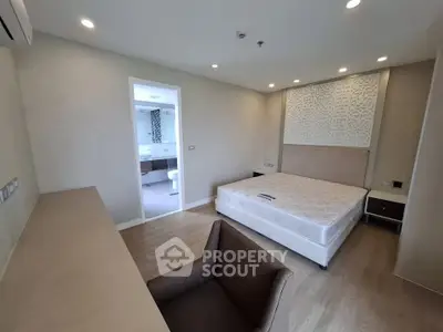 Spacious modern bedroom with ensuite bathroom and elegant decor