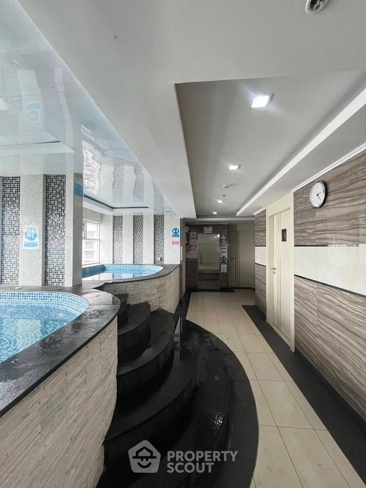 Luxurious indoor pool area with modern design and ambient lighting