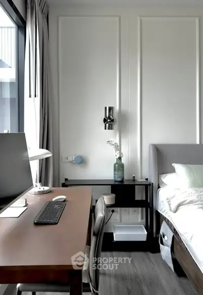 Modern bedroom with sleek workspace and stylish decor