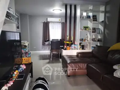 Spacious living room with modern decor and comfortable leather sofa