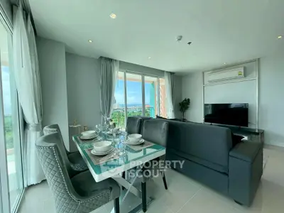 Modern living room with elegant dining area and stunning view